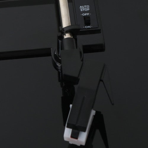 Que signifient les termes Auto Stop et Auto Return sur un tourne-disque ?